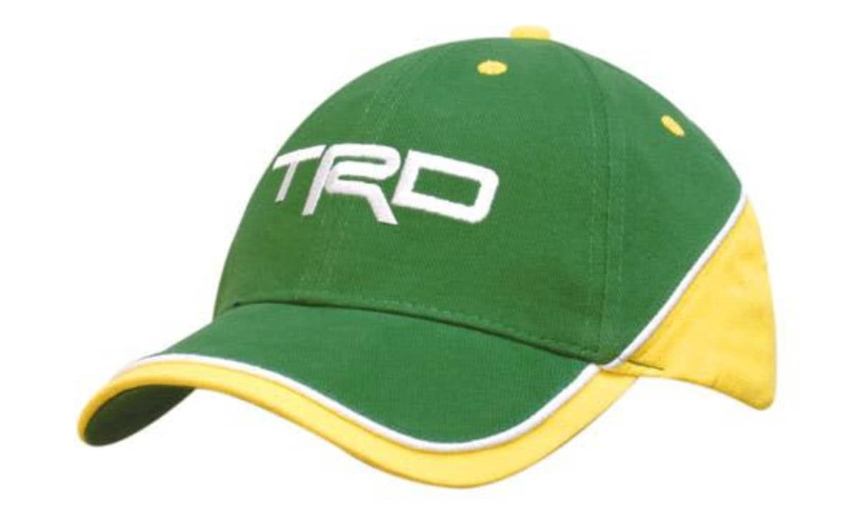 A green and yellow cap with contrasting panels and piping, featuring a logo on the front.