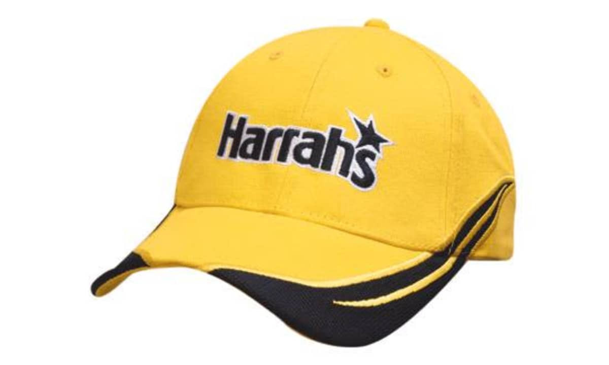 A yellow cap with a black visor and an embroidered logo on the front. Features peak and crown inserts.