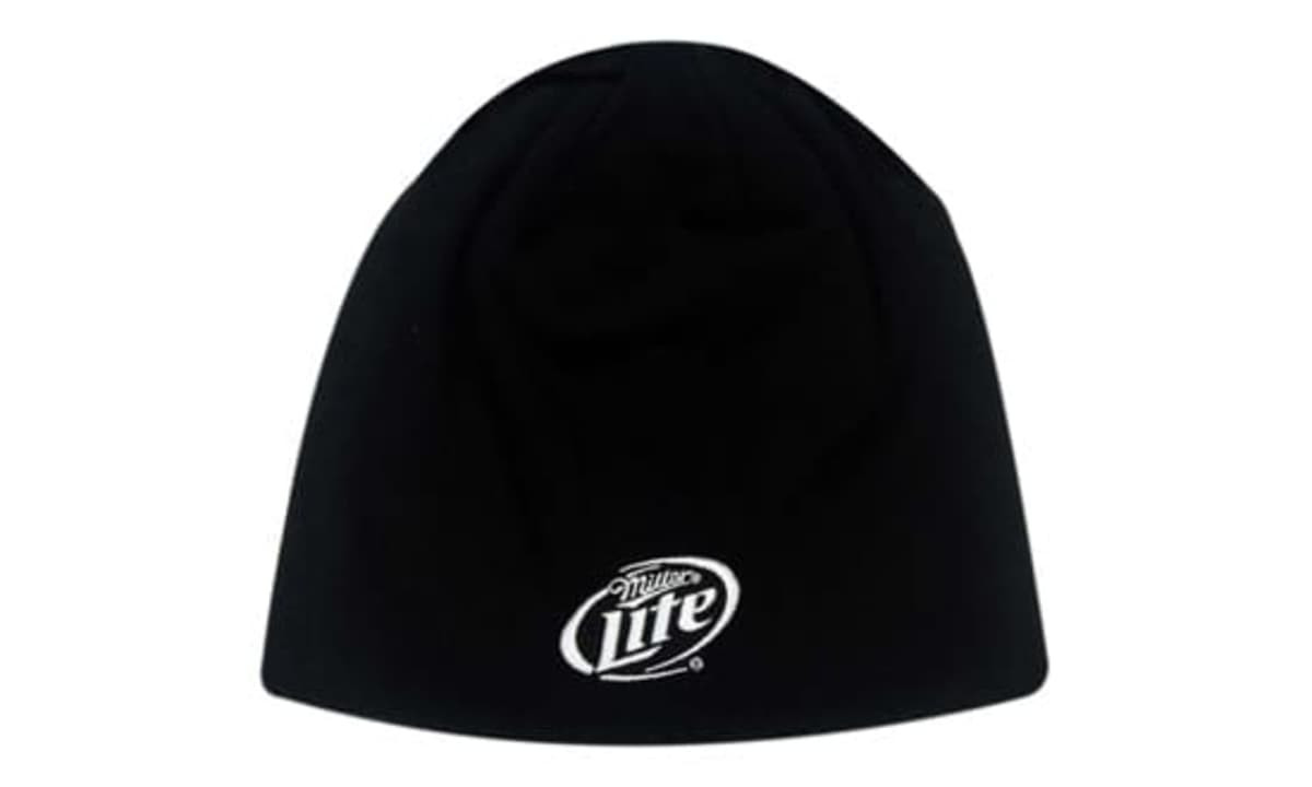 A black rolled down beanie made of 100% cotton, featuring a logo on the front.