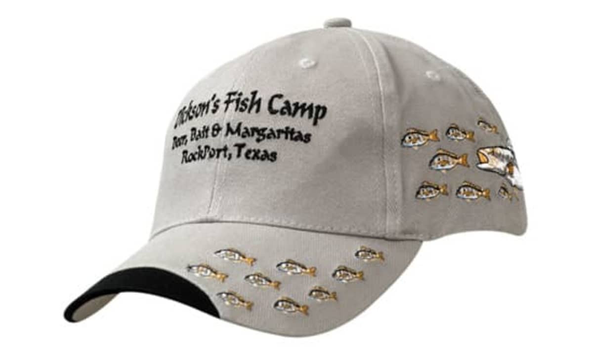 A grey cap with a curved peak and embroidered fish designs, featuring a logo on the front.