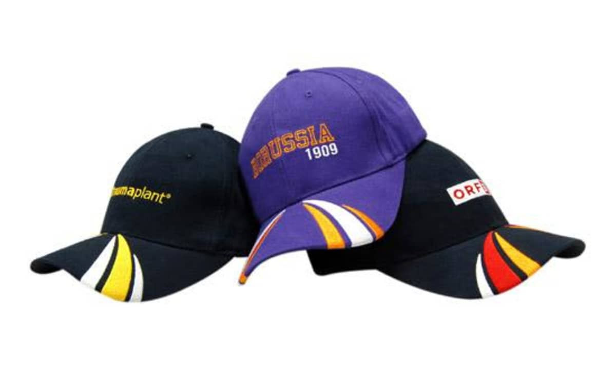 Three caps displayed together: one purple with embroidery, and two in black featuring colourful designs and logos.
