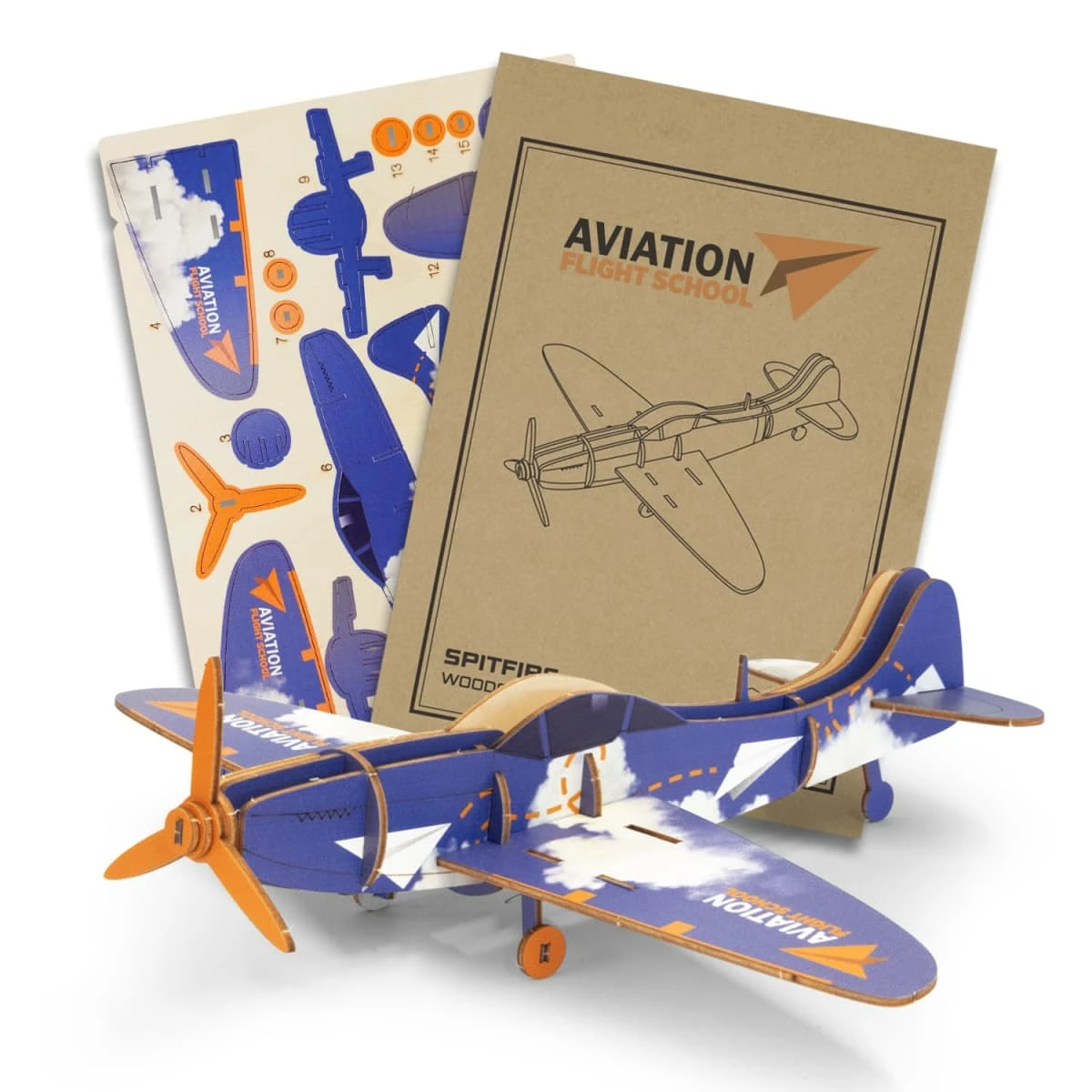 A wooden model of a Spitfire plane in blue and orange, accompanied by assembly instructions and design sheets.