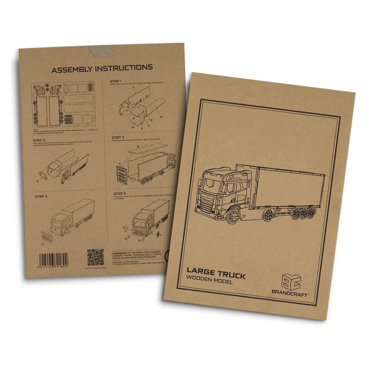A packaged wooden model of a large truck with assembly instructions and a simple monochrome design, featuring a logo.