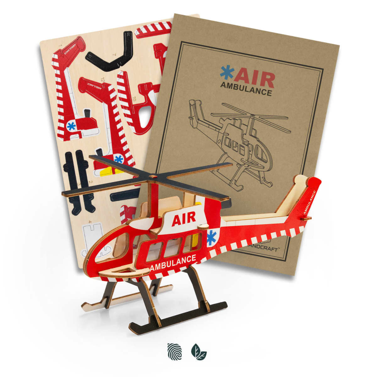 A wooden model helicopter in red and white, with assorted assembly pieces and packaging for the BRANDCRAFT product.