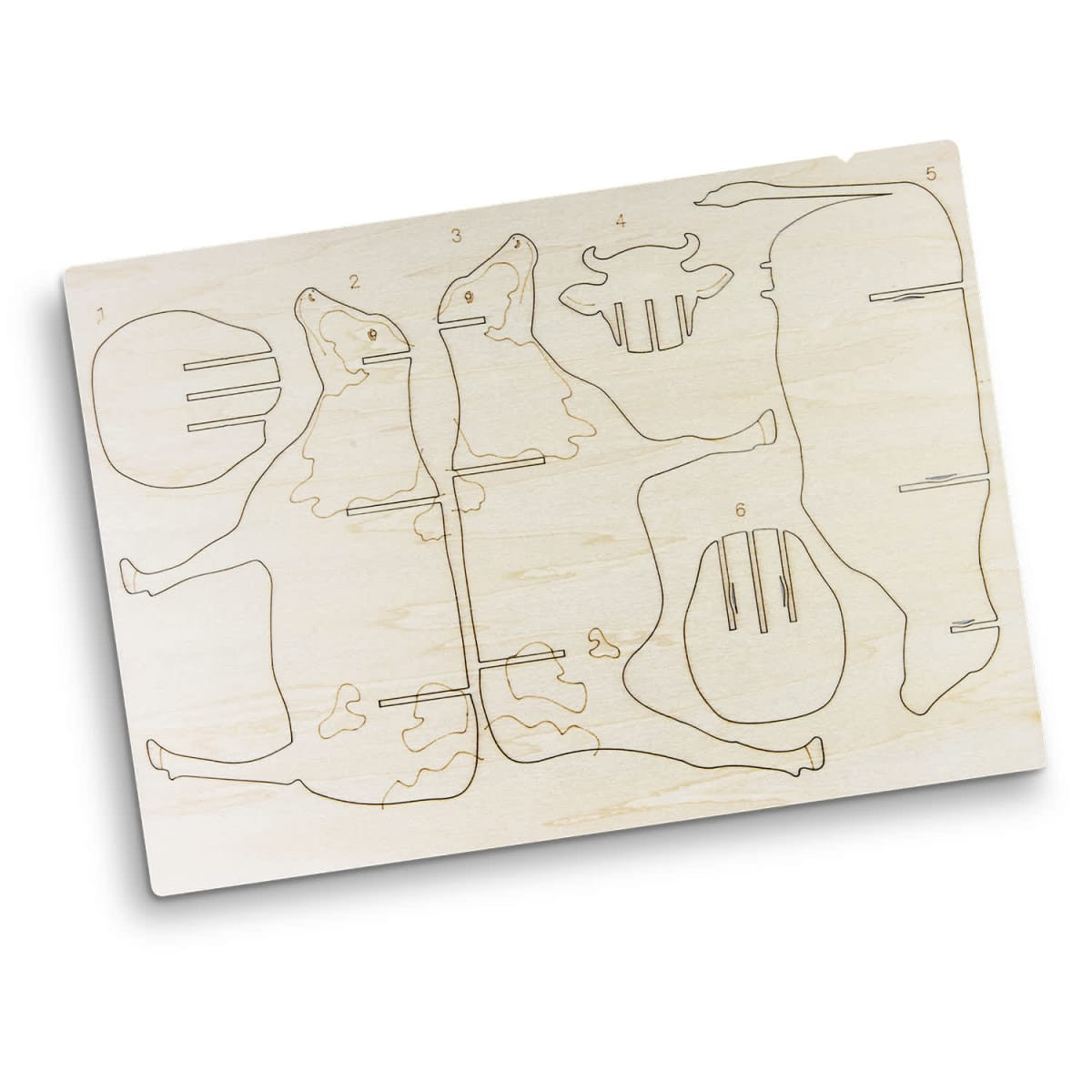 A wooden model kit featuring a cow design, with engraved parts for assembly on a light-coloured wood base.