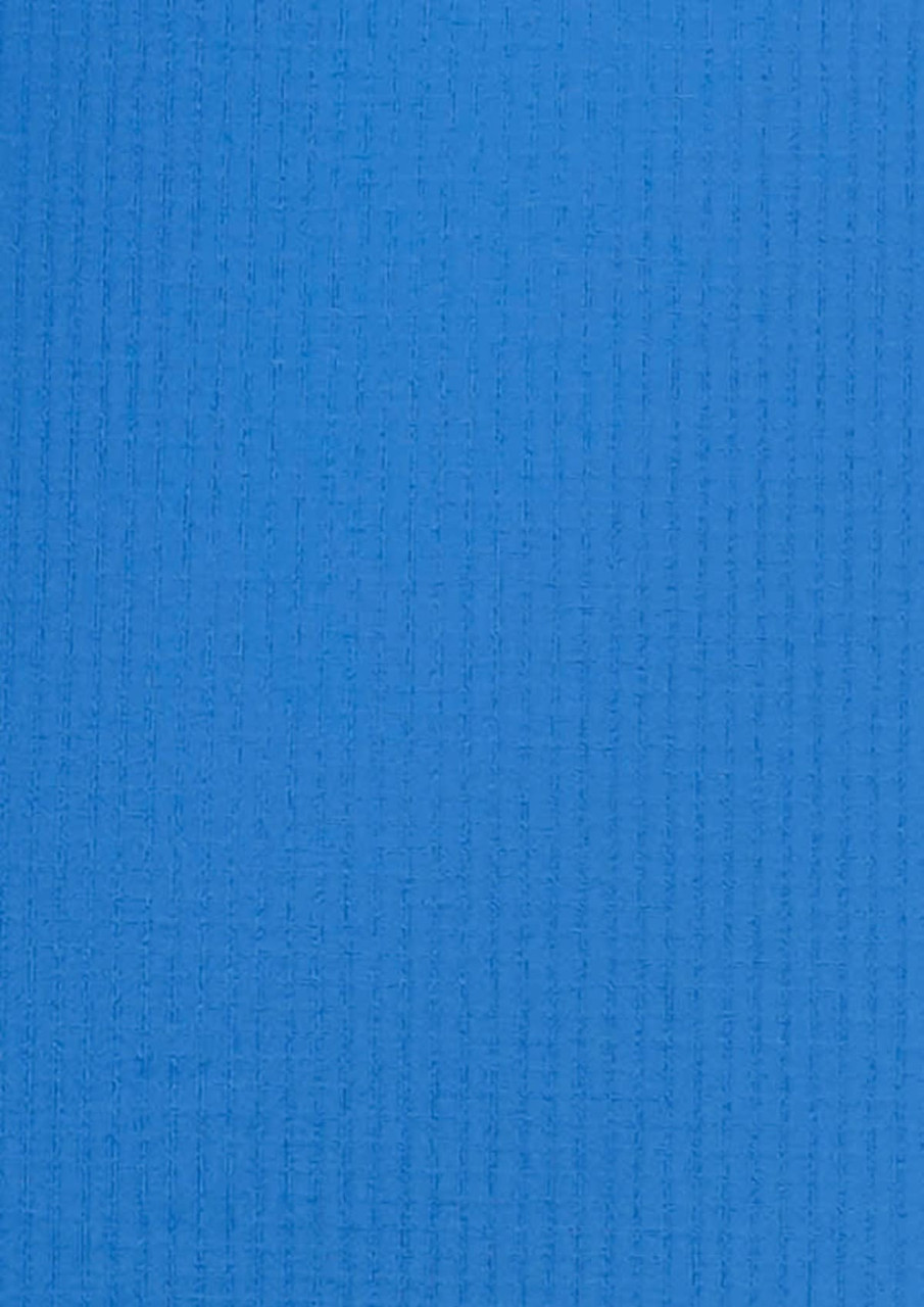 A blue, textured fabric showcasing a button-up shirt design. Features a logo in the corner.