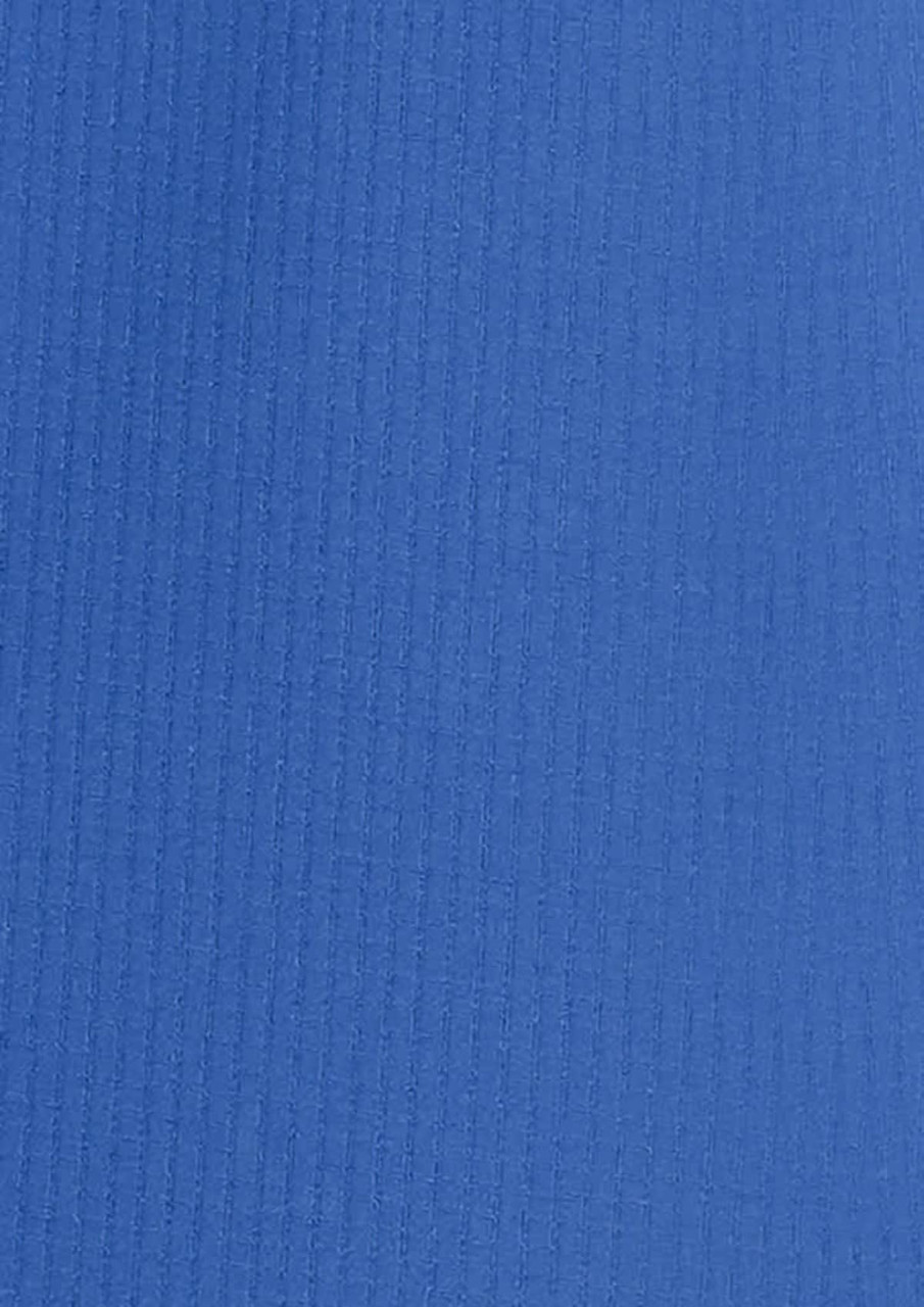 A blue women's outdoor long sleeve button-up shirt with a textured fabric. It features a logo.