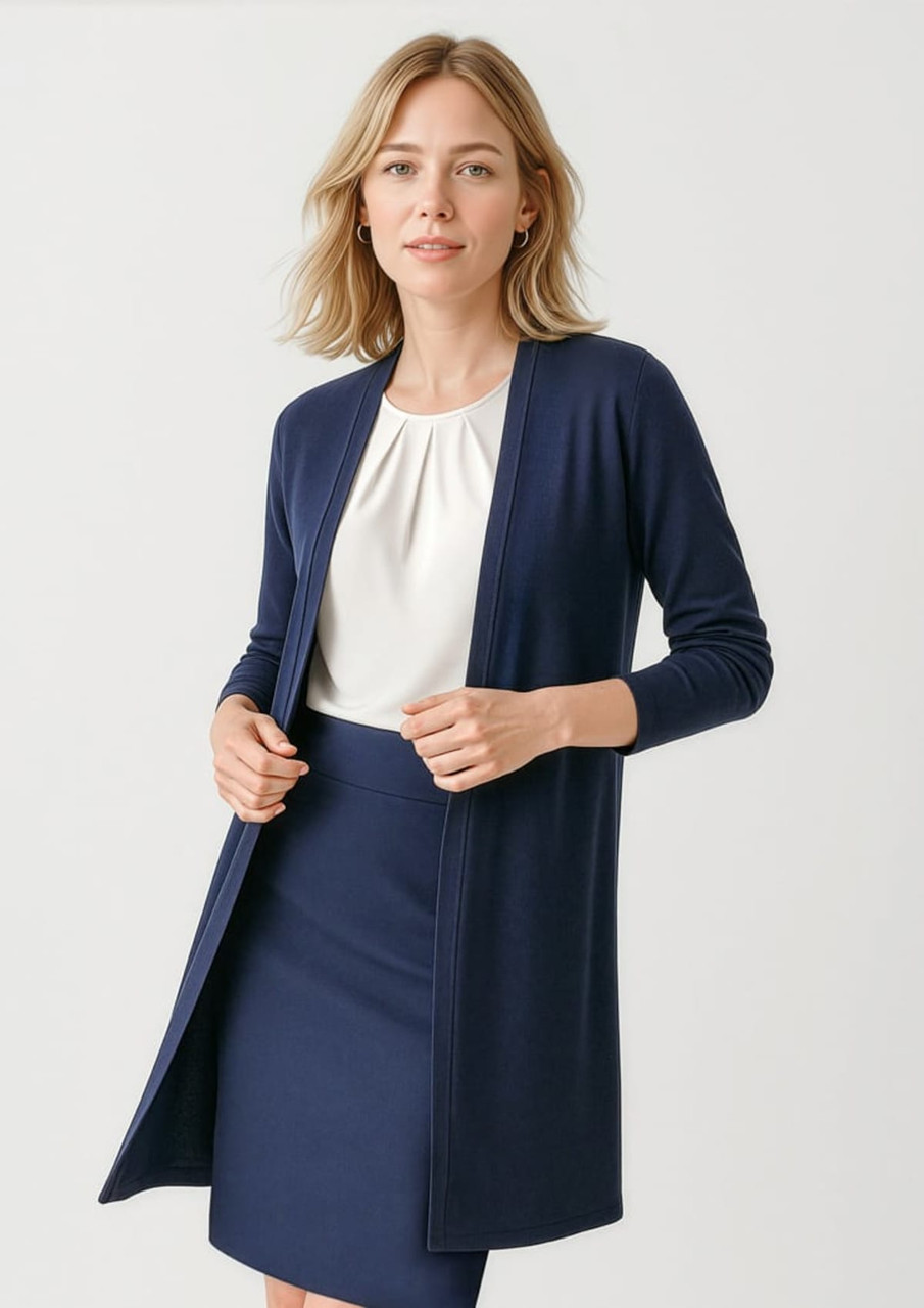 A longline cardigan in navy, featuring an open front and long sleeves, paired with a blouse and skirt.