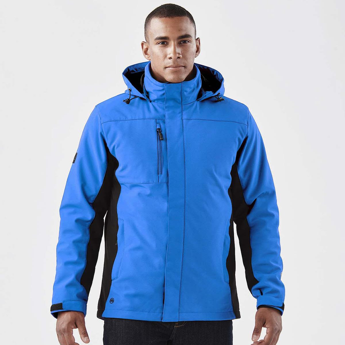A men's 3-in-1 jacket in bright blue with black accents and a hood, featuring a logo on the sleeve.