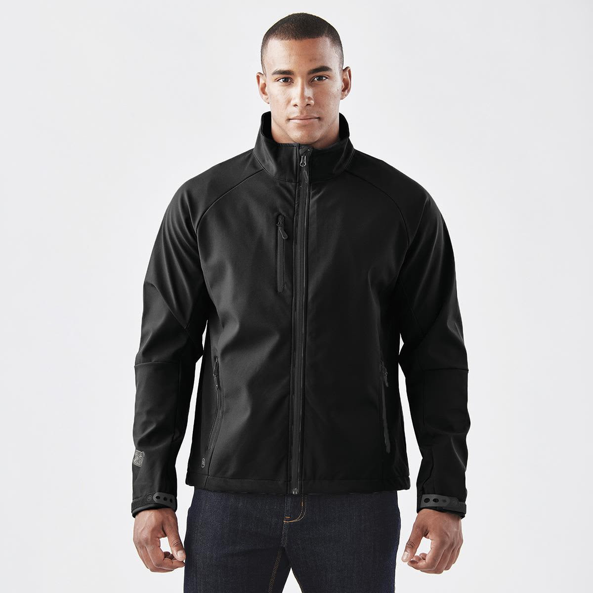 A black ultra-light shell jacket with a zip front and side pockets, featuring a logo on the sleeve.