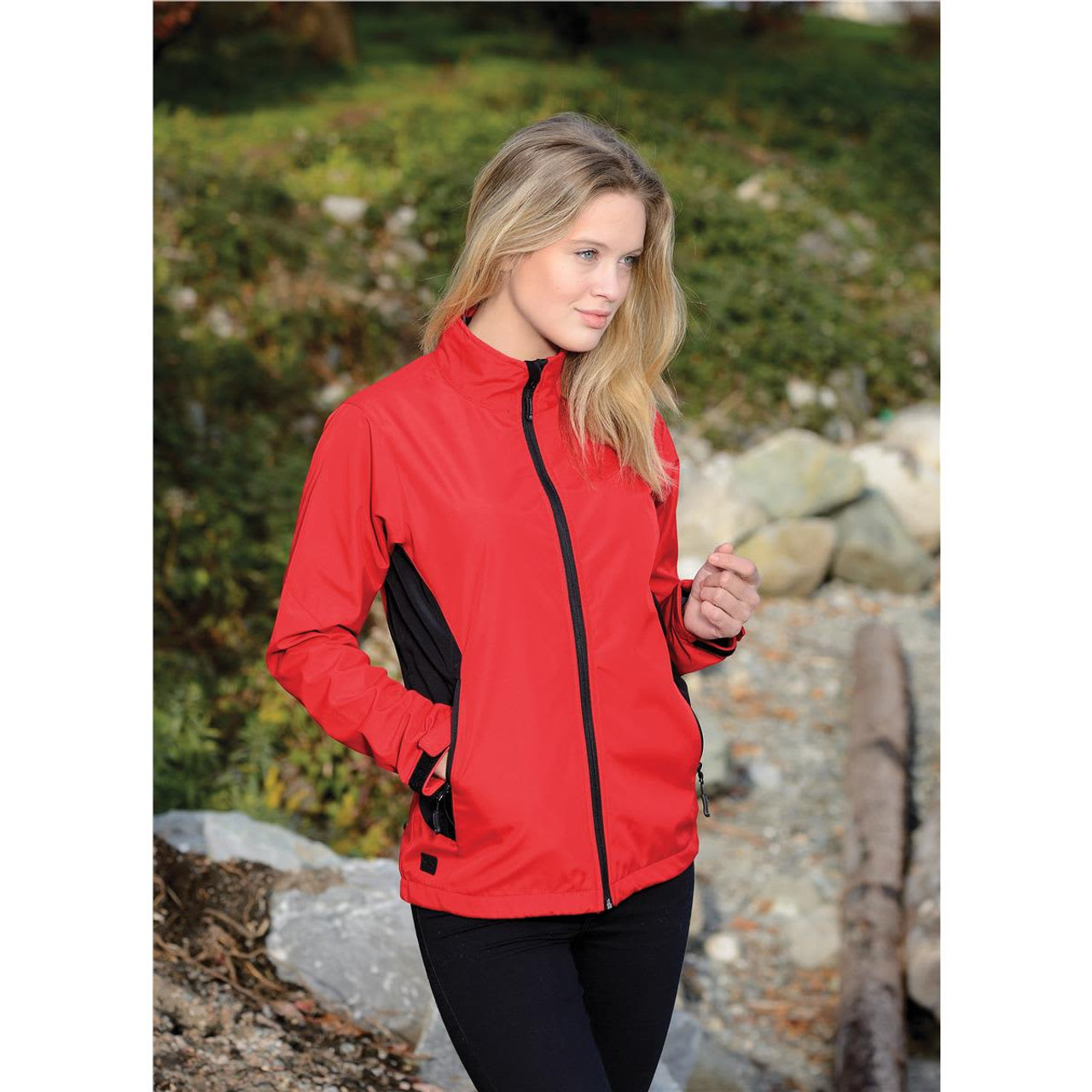 A red women's softshell jacket with black accents, featuring a zipper and two side pockets.