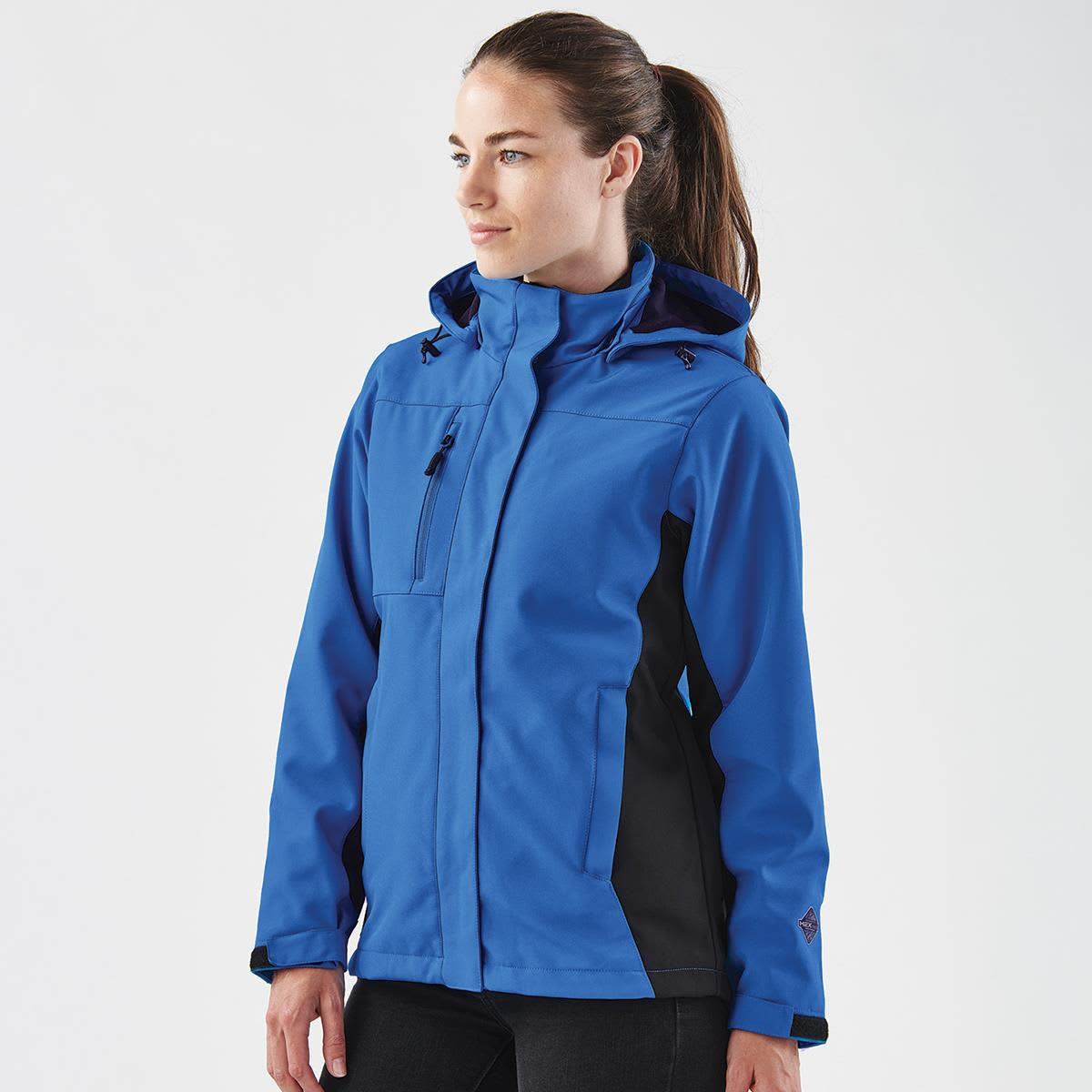 A blue and black women's jacket with a hood, featuring a logo on the sleeve.