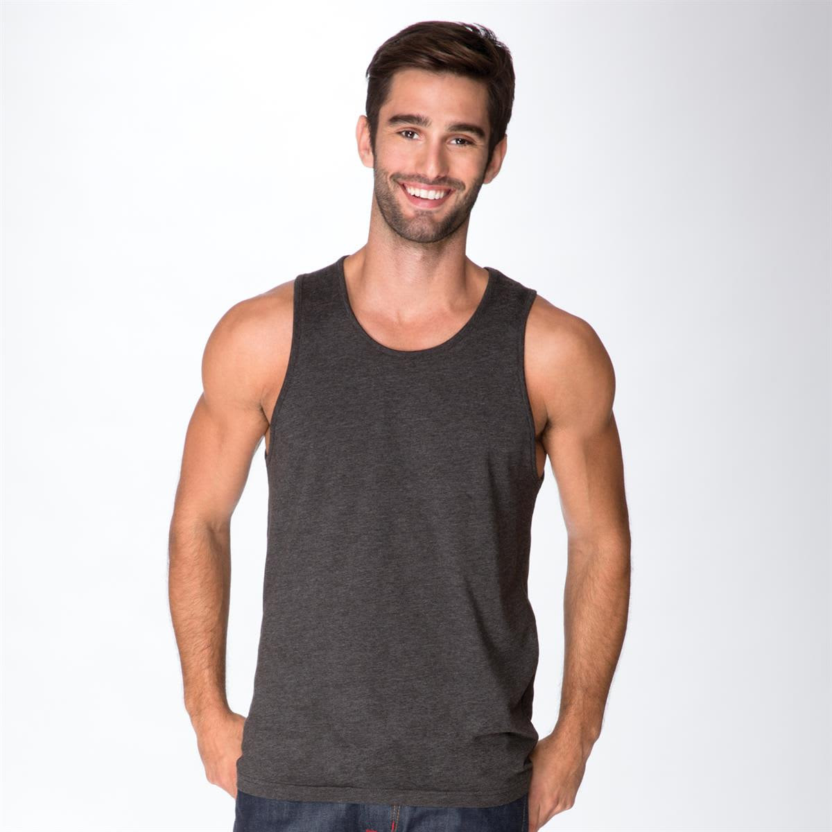 A man wearing a dark grey tank top, featuring a slim fit and no sleeves, standing against a light background.