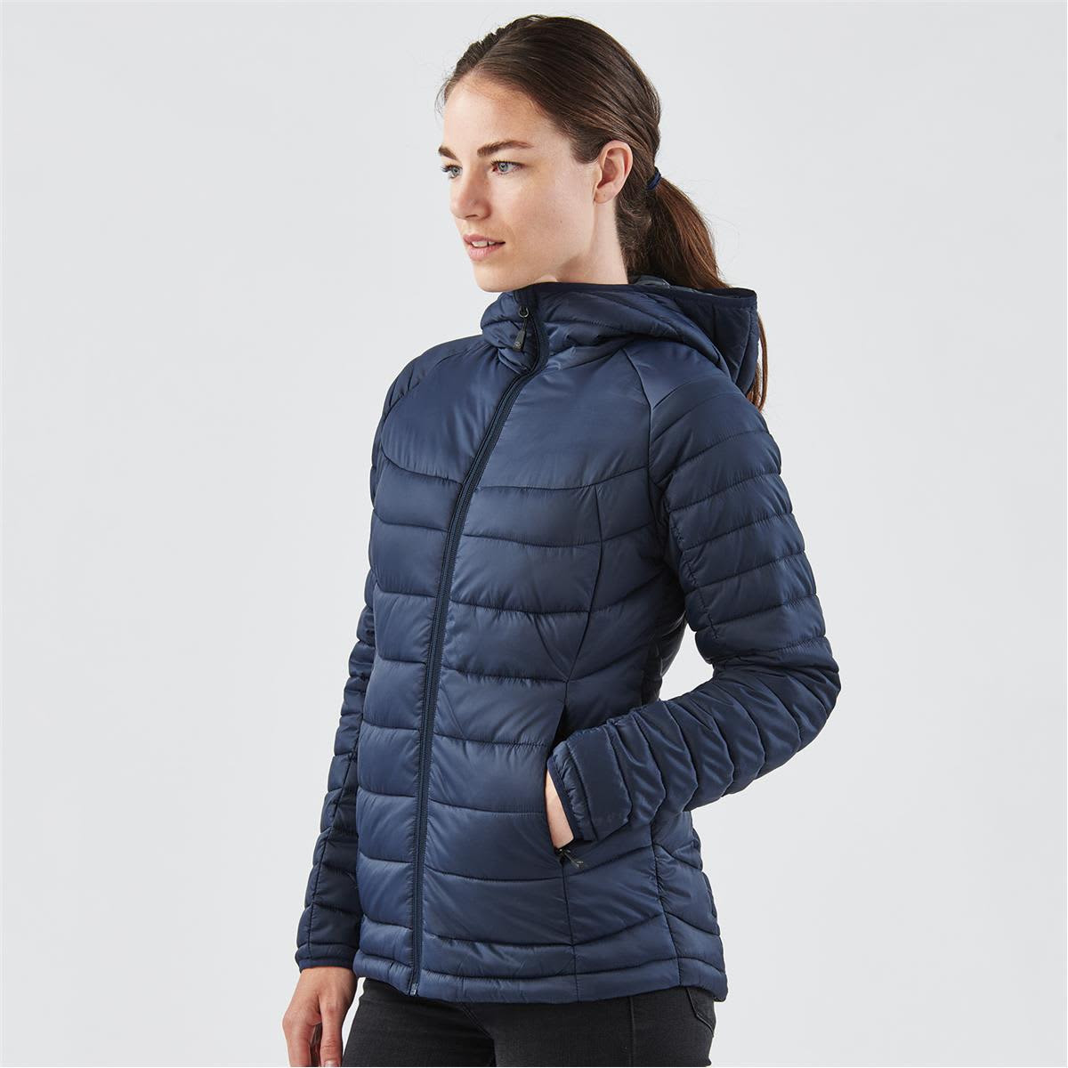 A women's thermal jacket in navy blue with a zip front, hood, and side pockets, featuring a logo.