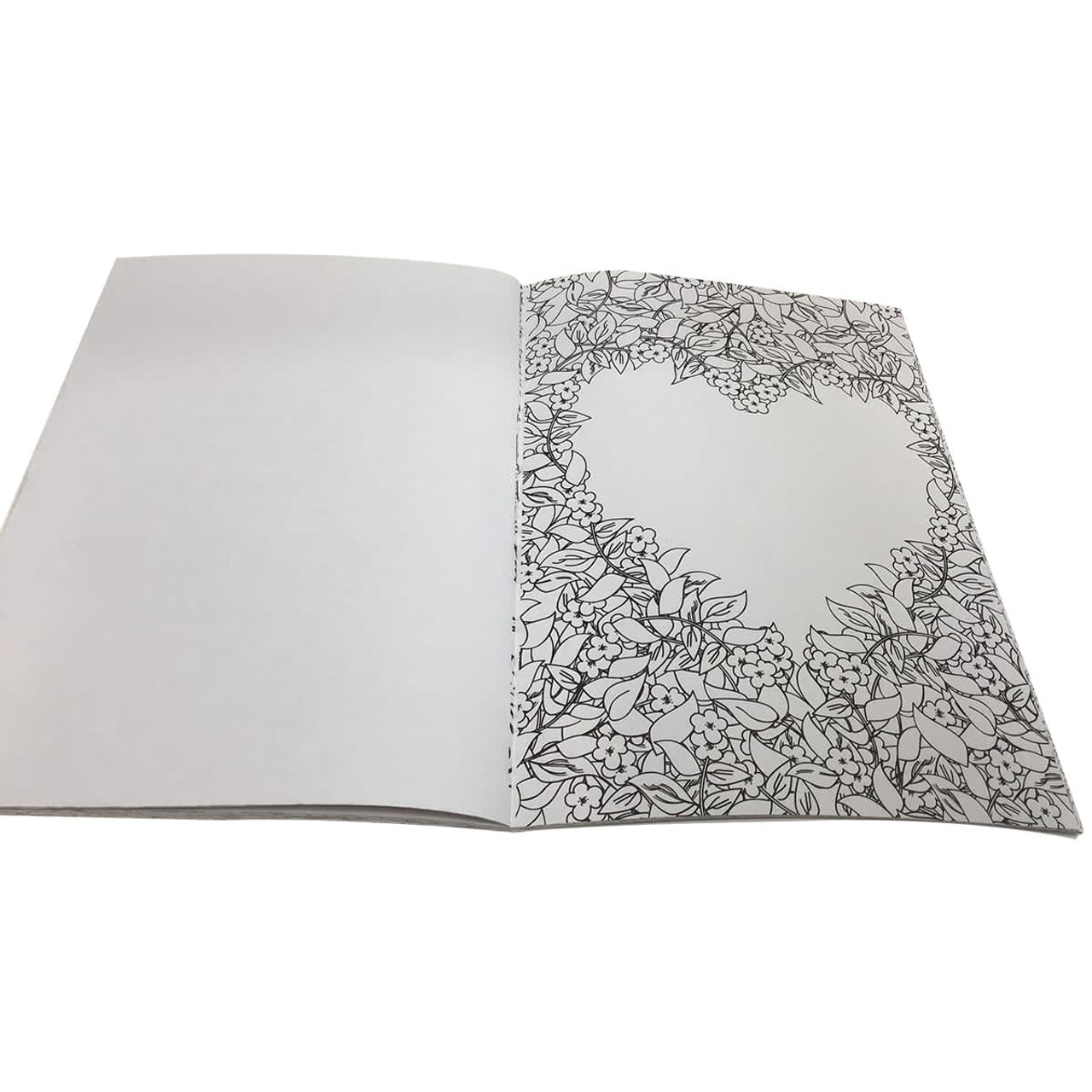 A5 colouring book with intricate floral designs on one page, featuring a heart-shaped outline. The pages are blank inside. A5 colouring book with intricate floral designs on one page, featuring a heart-shaped outline. The pages are blank inside.