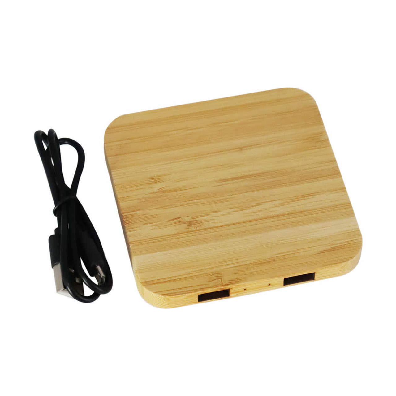 A bamboo wireless charging dock with two USB ports and a black charging cable.