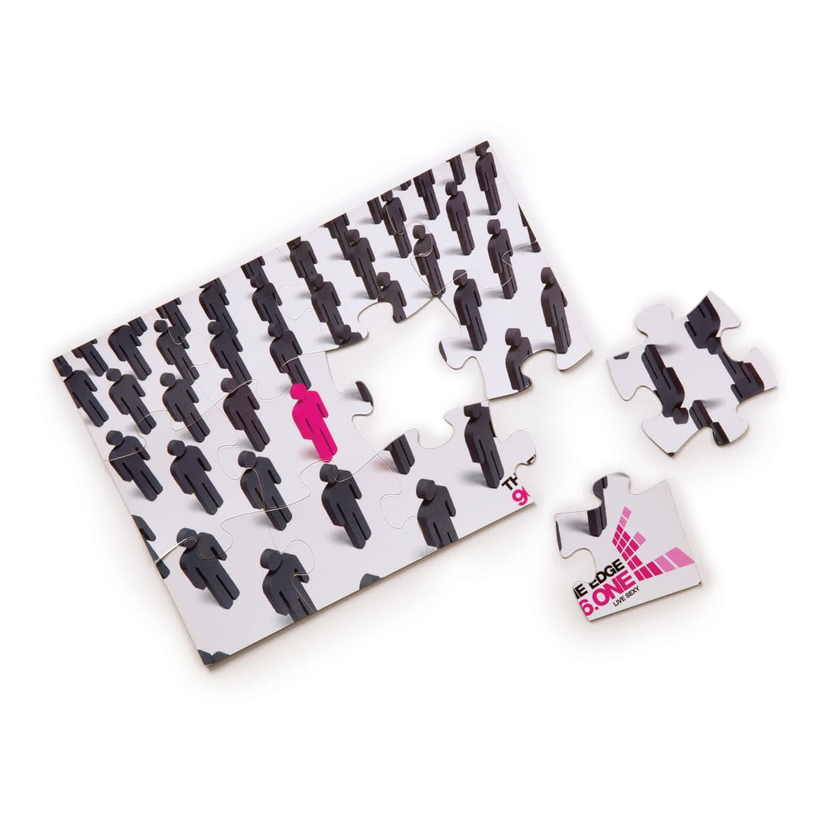 A5 jigsaw puzzle featuring a design of black figures with one pink figure, alongside several loose pieces.