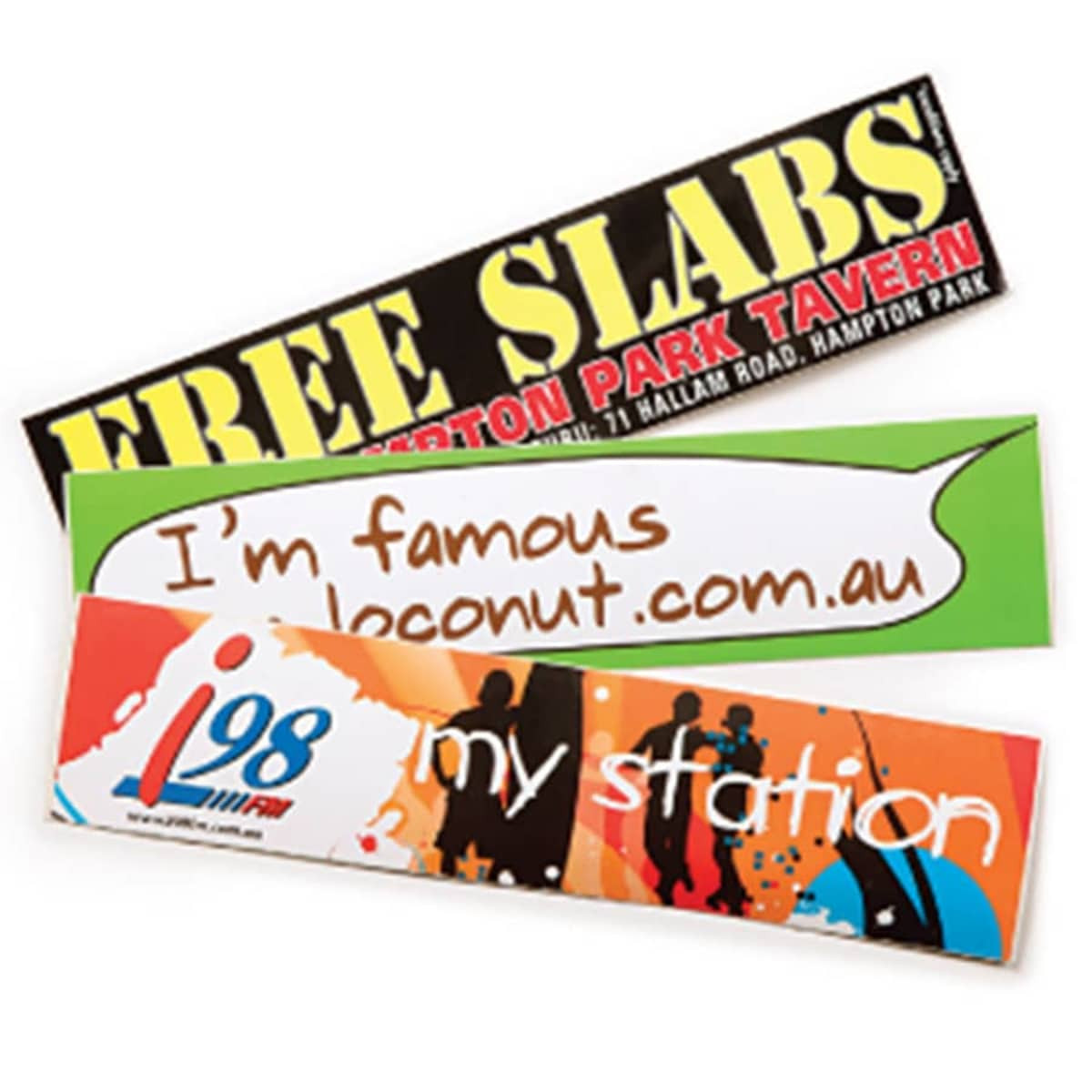 Three glossy paper stickers in various colours, featuring different designs and a logo on one of them.