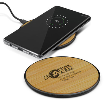 A bamboo wireless charger in a circular shape with a black base, alongside a smartphone displaying a charging status. A bamboo wireless charger in a circular shape with a black base, alongside a smartphone displaying a charging status.