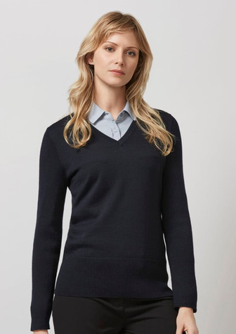 A dark navy pullover jumper with a V-neck design, worn over a light blue shirt. It features long sleeves and a fitted style. A dark navy pullover jumper with a V-neck design, worn over a light blue shirt. It features long sleeves and a fitted style.
