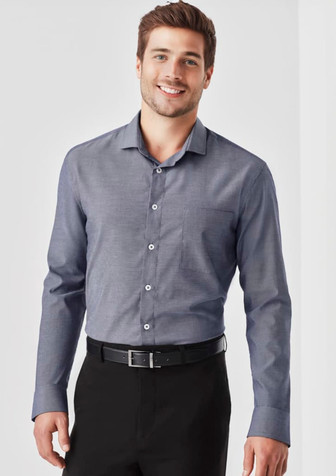 A long sleeve button-up shirt in a navy hue featuring a chest pocket and a brand logo. A long sleeve button-up shirt in a navy hue featuring a chest pocket and a brand logo.