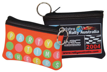 Two rectangular coin bags in bright orange and black, featuring a polka dot design and a logo. Each has a keyring attached.