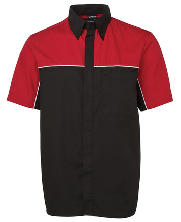 A button-up shirt featuring a black body with red sleeves and a pocket, including a logo.