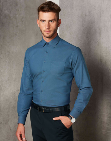 Men's pin dot stretch long-sleeve shirt in teal blue, featuring a collar and single chest pocket, with branding visible.