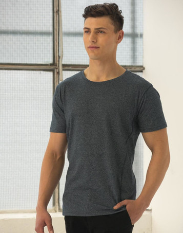 A model wearing a blue heather short-sleeve t-shirt with a relaxed fit, featuring a visible logo. A model wearing a blue heather short-sleeve t-shirt with a relaxed fit, featuring a visible logo.