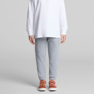 Grey track pants designed for kids, featuring a comfortable fit and ending in cuffs, paired with casual shoes. Grey track pants designed for kids, featuring a comfortable fit and ending in cuffs, paired with casual shoes.