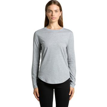 A light grey long-sleeve T-shirt with a rounded hem, modelled by a woman. Features branding. A light grey long-sleeve T-shirt with a rounded hem, modelled by a woman. Features branding.