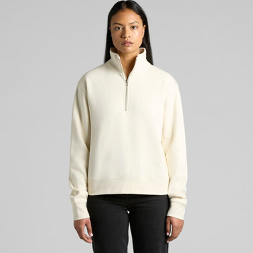 A cream-coloured half zip crew jumper with a relaxed fit and long sleeves, featuring a small logo. A cream-coloured half zip crew jumper with a relaxed fit and long sleeves, featuring a small logo.