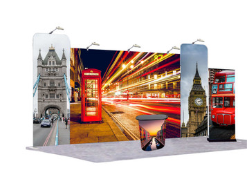 A tension fabric exhibition booth featuring London cityscapes, including a red telephone box and iconic landmarks, with lights.