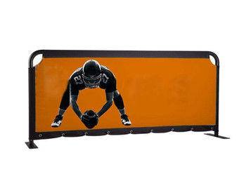 A promotional barrier skin featuring a black and orange design, showcasing a football player in action, with a logo present. A promotional barrier skin featuring a black and orange design, showcasing a football player in action, with a logo present.