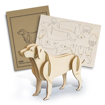 A wooden dog model stands beside its assembly template, crafted from light-coloured wood with detailed cutouts. A wooden dog model stands beside its assembly template, crafted from light-coloured wood with detailed cutouts.