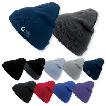 A collection of beanies in various colours, including navy, grey, black, light blue, red, and purple, with logos.