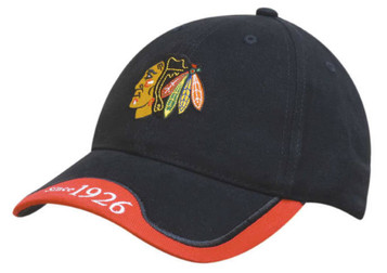 A black cap with a peak indent and embroidered trim, featuring a logo on the front and red detailing on the brim. A black cap with a peak indent and embroidered trim, featuring a logo on the front and red detailing on the brim.