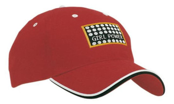 A red cap with a double peak trim and a logo featuring dots and the phrase "Girl Power."