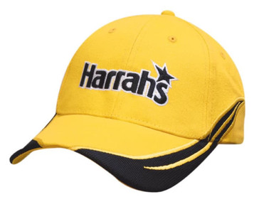 A yellow cap with black accents and an embroidered logo. It features a peak and crown inserts. A yellow cap with black accents and an embroidered logo. It features a peak and crown inserts.