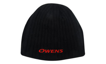 A black cable knit roll down beanie with a logo on the front. The beanie features a textured design.