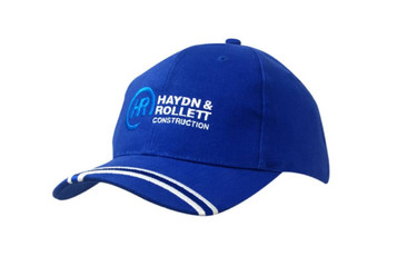 A blue brushed heavy cotton cap with an embroidered logo on the peak and white striped detailing. A blue brushed heavy cotton cap with an embroidered logo on the peak and white striped detailing.