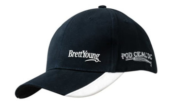 A navy cap with white peak indents and embroidery, featuring a logo on the front and side.