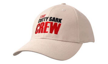 A beige cap with a curved brim, featuring embroidered text and a logo on the front.