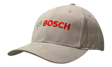 A beige cap with a contrasting peak, featuring a logo on the front.