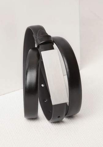 A black women's leather belt featuring a sleek, silver-tone buckle and a minimalist design. A black women's leather belt featuring a sleek, silver-tone buckle and a minimalist design.