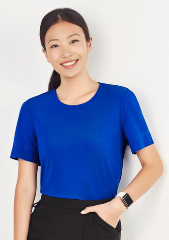 A women's short sleeve jersey top in bright blue, featuring a classic round neckline and a logo on the sleeve. A women's short sleeve jersey top in bright blue, featuring a classic round neckline and a logo on the sleeve.
