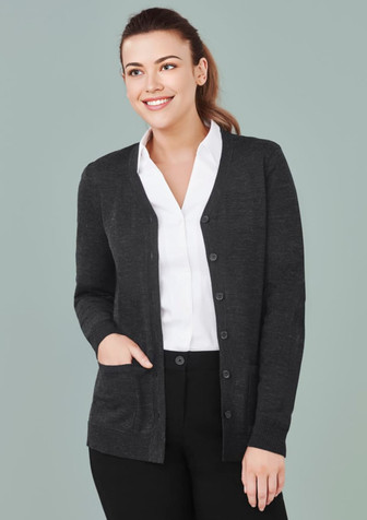 A dark grey women's button-front knit cardigan with a pocket, worn over a white shirt. A dark grey women's button-front knit cardigan with a pocket, worn over a white shirt.