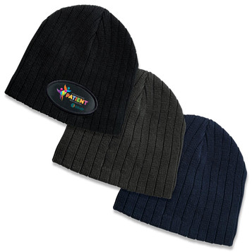 A collection of three cable knit beanies in black, olive green, and navy blue, each featuring a logo.