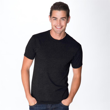 A black tri-blend crew t-shirt featured on a smiling man, with a simple design and a logo present.