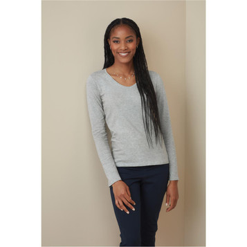A grey long sleeve shirt with a V-neck, worn by a model with long, straight hair. Features a subtle logo. A grey long sleeve shirt with a V-neck, worn by a model with long, straight hair. Features a subtle logo.